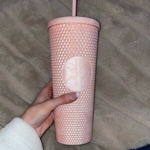 Peachy pink Starbucks cup